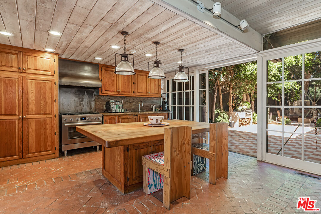 23441 Malibu Colony Road Malibu, CA 90265 - Photo 8 of 43 a kitchen with a stove and a refrigerator