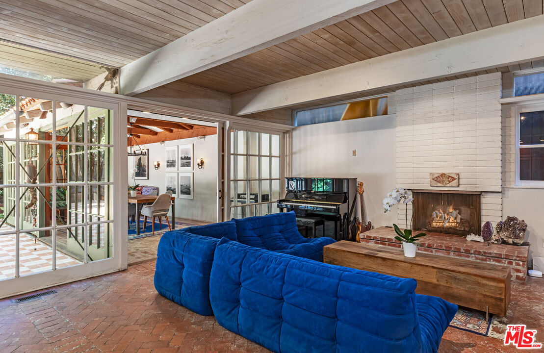 23441 Malibu Colony Road Malibu, CA 90265 - Photo 9 of 43 a living room with furniture and a fireplace