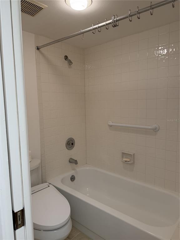 2004 Longpointe Circle Venice, FL 34293 - Photo 43 of 54 a bathroom with a bathtub shower and toilet