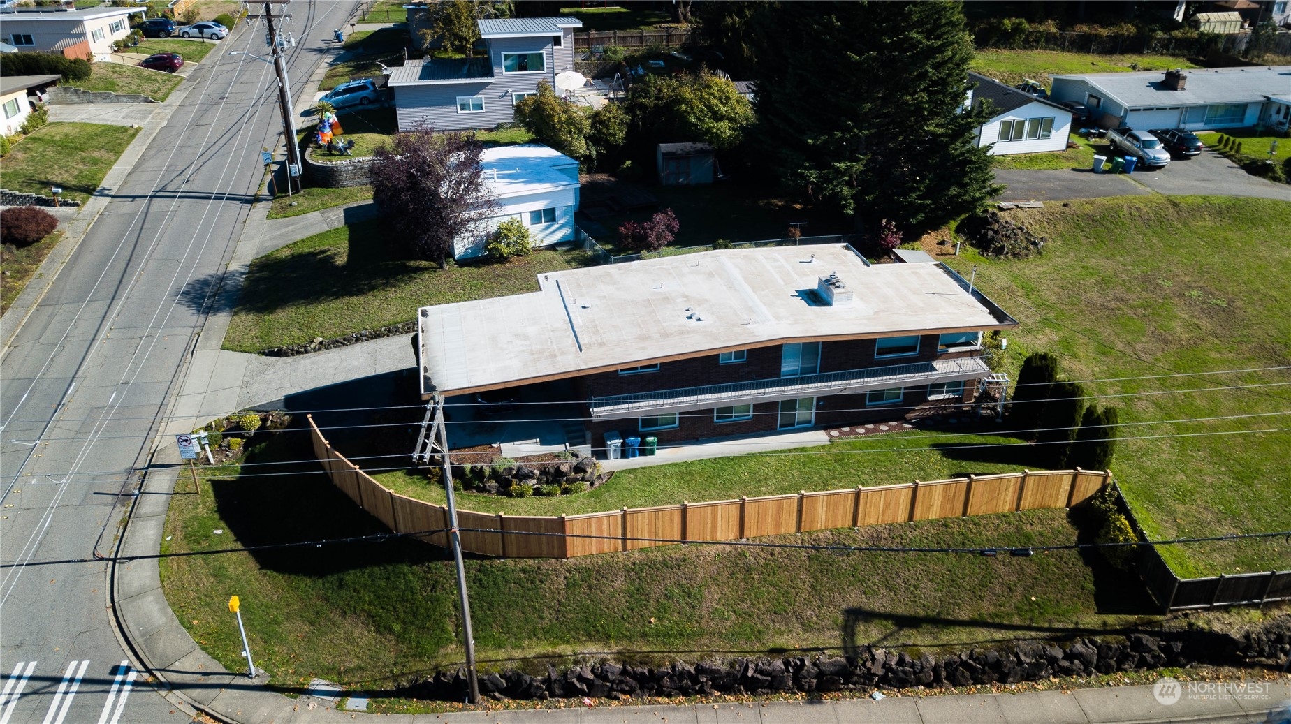 678 Sunset Boulevard Northeast Renton, WA 98056 - Photo 1 of 31 an aerial view of a house with a yard