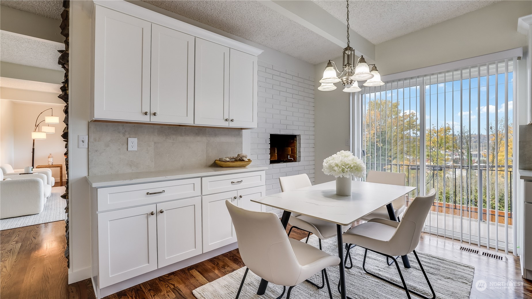 678 Sunset Boulevard Northeast Renton, WA 98056 - Photo 11 of 31 a dining room with furniture a chandelier and wooden floor