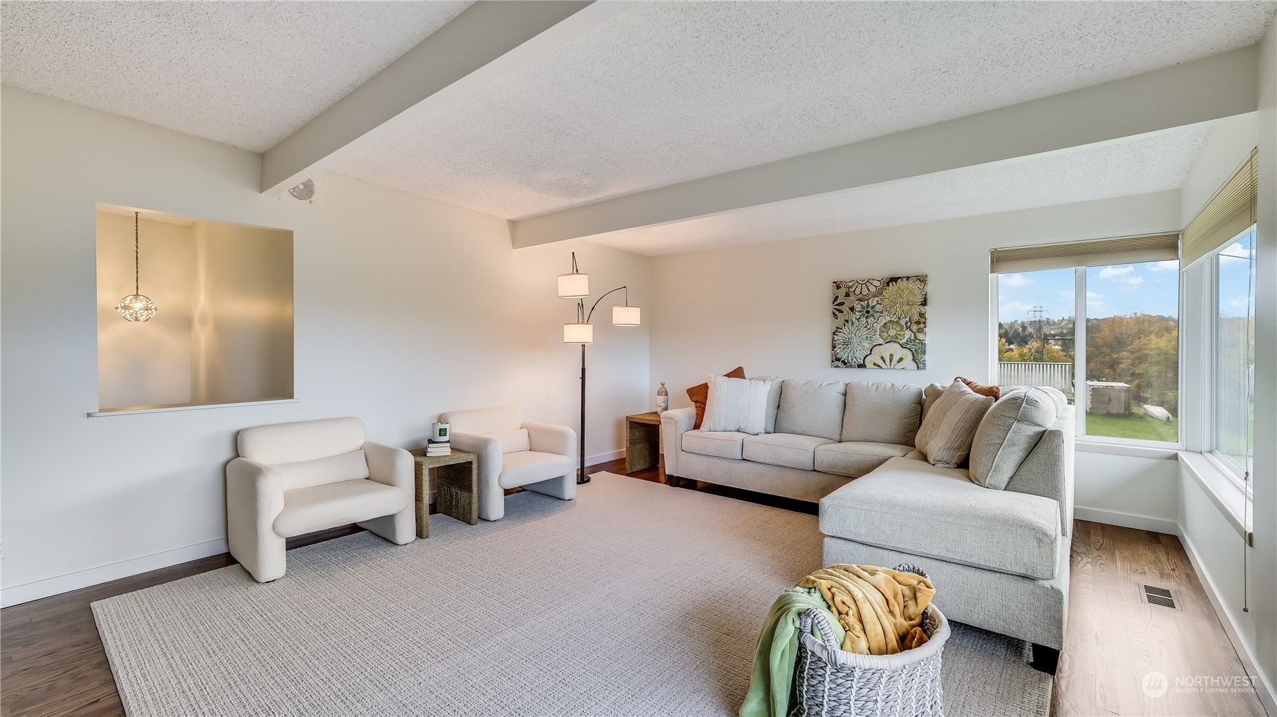 678 Sunset Boulevard Northeast Renton, WA 98056 - Photo 13 of 31 a living room with furniture and a large window