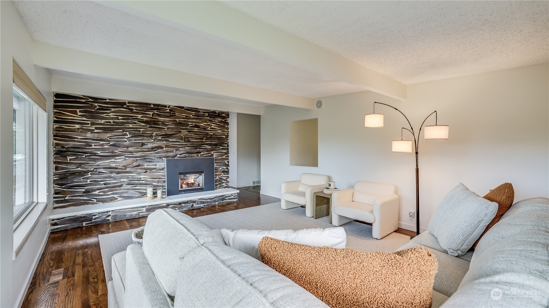678 Sunset Boulevard Northeast Renton, WA 98056 - Photo 14 of 31 a living room with furniture and a fireplace