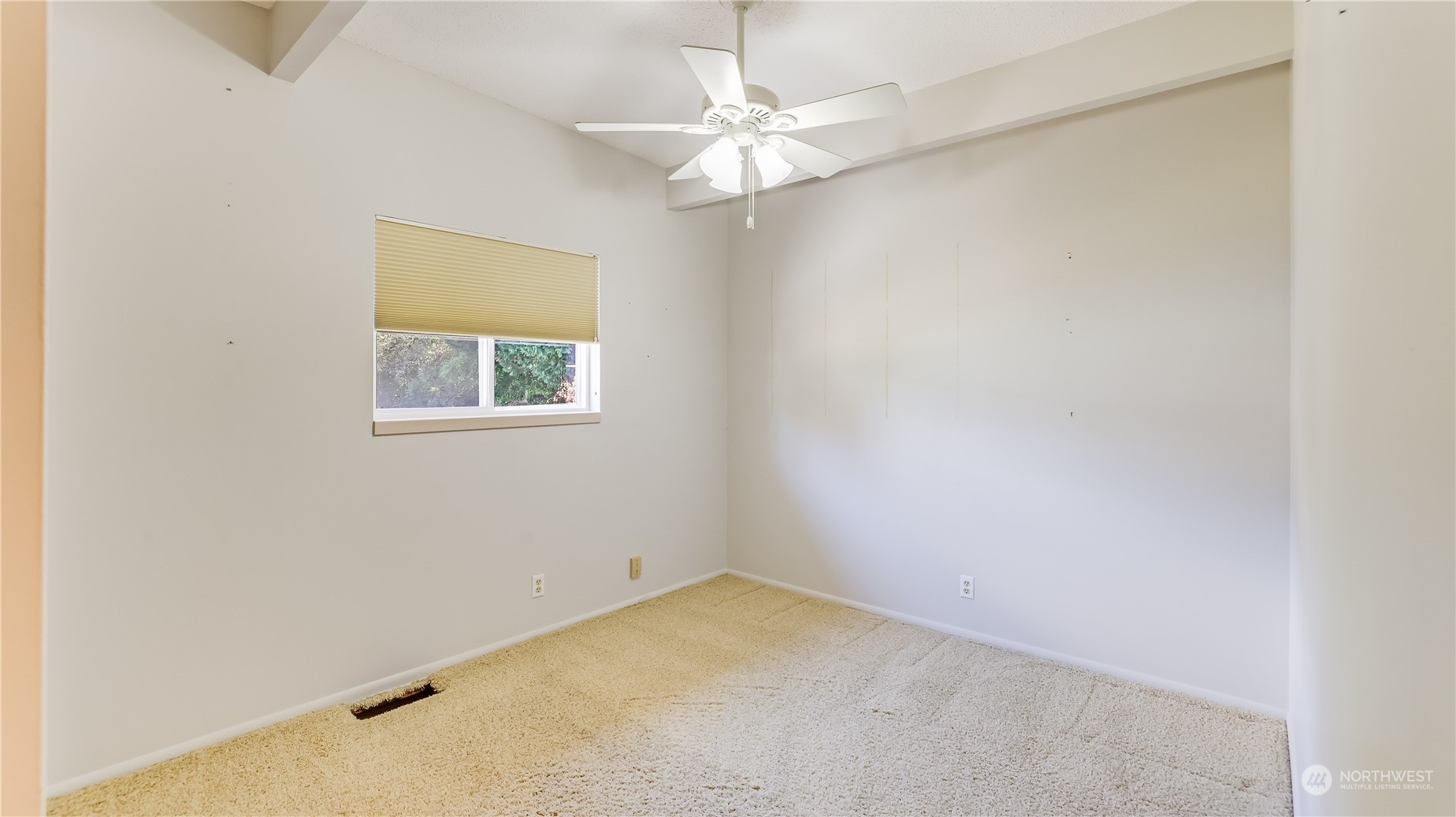 678 Sunset Boulevard Northeast Renton, WA 98056 - Photo 18 of 31 an empty room with a window and a fan