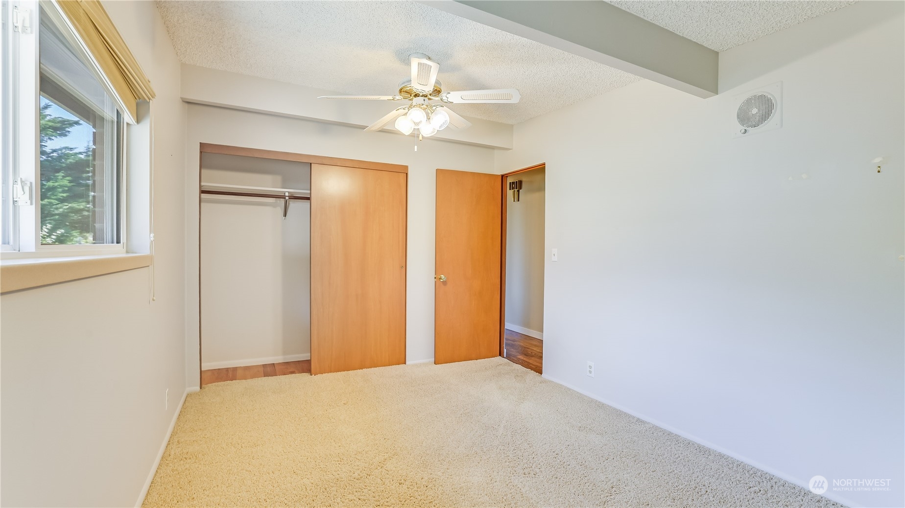 678 Sunset Boulevard Northeast Renton, WA 98056 - Photo 20 of 31 an empty room with a ceiling fan and a window