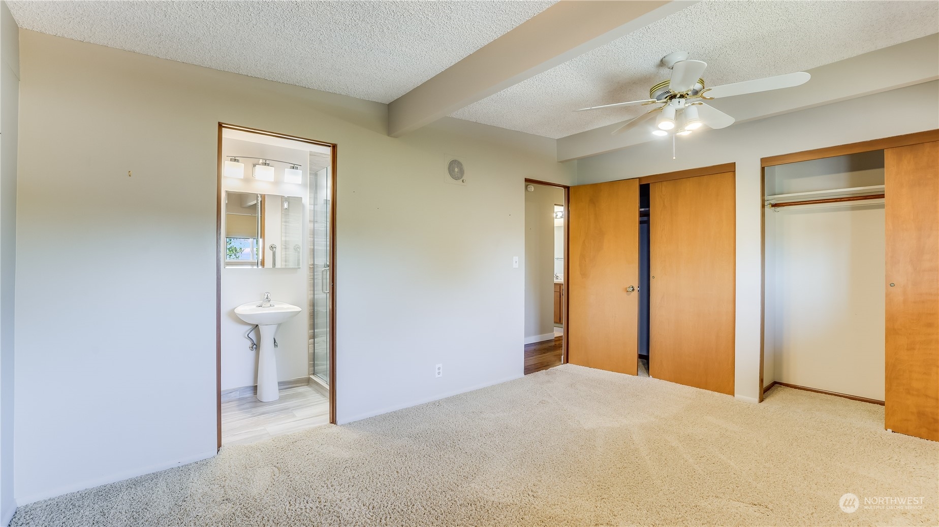 678 Sunset Boulevard Northeast Renton, WA 98056 - Photo 24 of 31 a view of an empty room with a chandelier fan