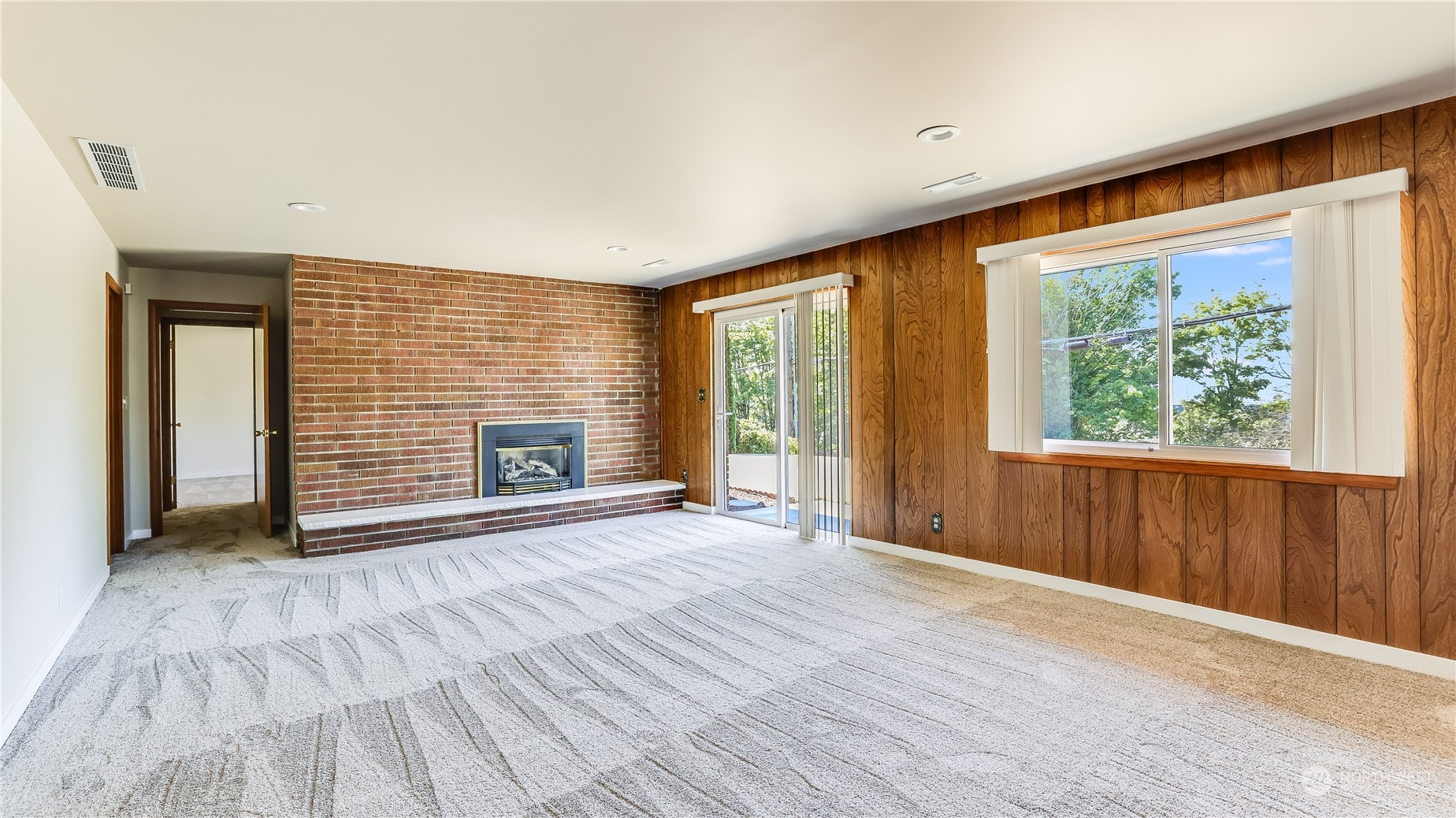 678 Sunset Boulevard Northeast Renton, WA 98056 - Photo 28 of 31 a view of an empty room with a window and wooden floor
