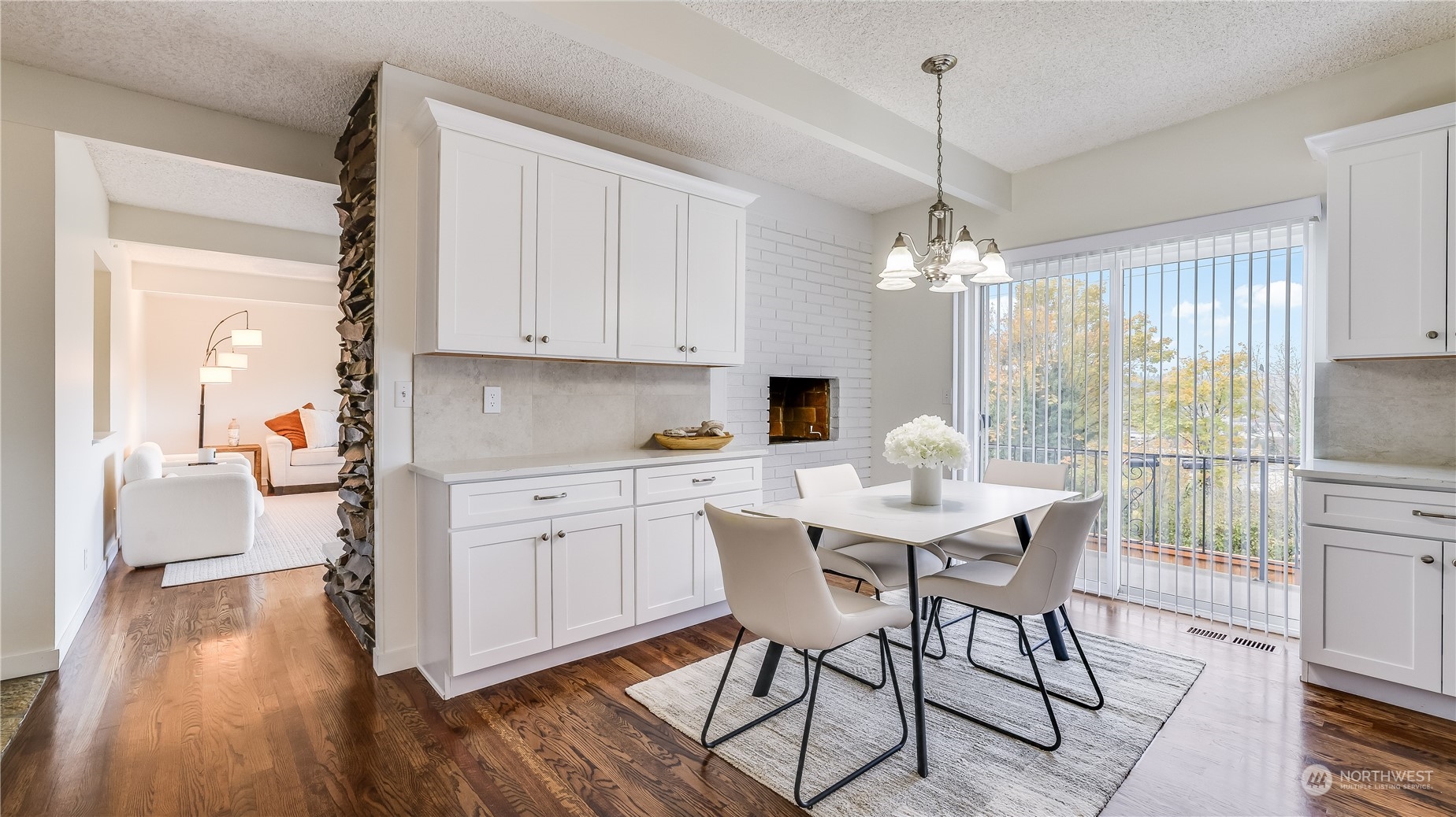 678 Sunset Boulevard Northeast Renton, WA 98056 - Photo 6 of 31 a view of a dining room with furniture window and wooden floor