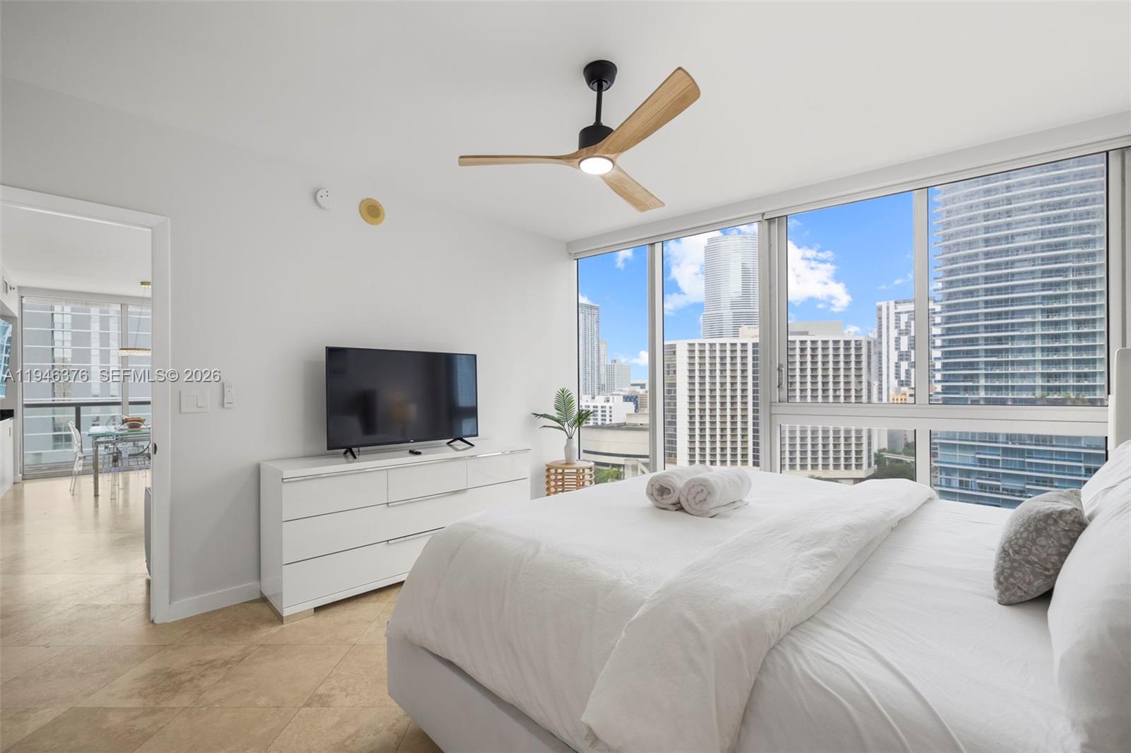 485 Brickell Avenue, Unit 1804 Miami, FL 33131 - Photo 16 of 60 a bedroom with a bed and a flat screen tv