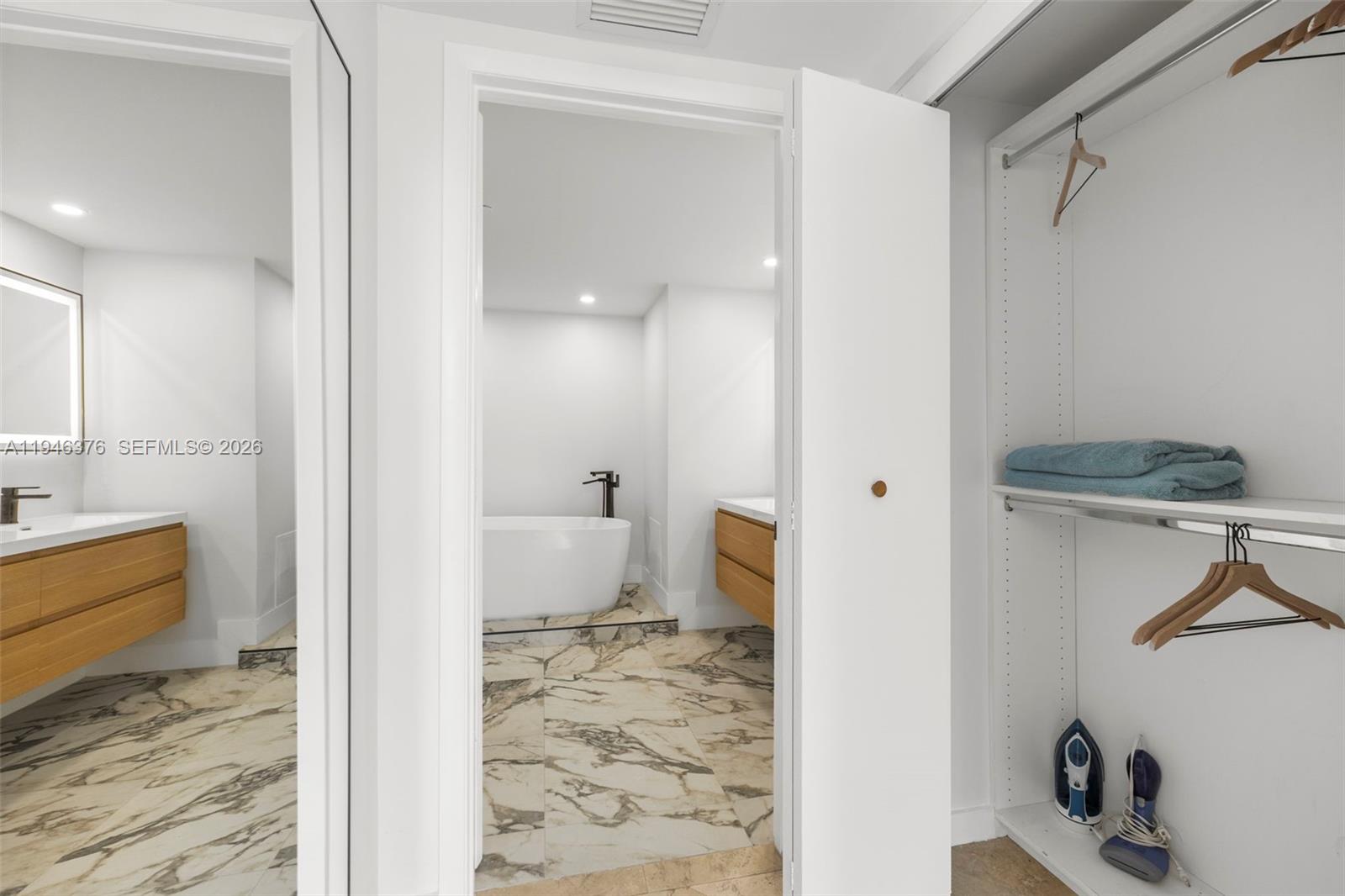 485 Brickell Avenue, Unit 1804 Miami, FL 33131 - Photo 17 of 60 a bathroom with a sink and a toilet