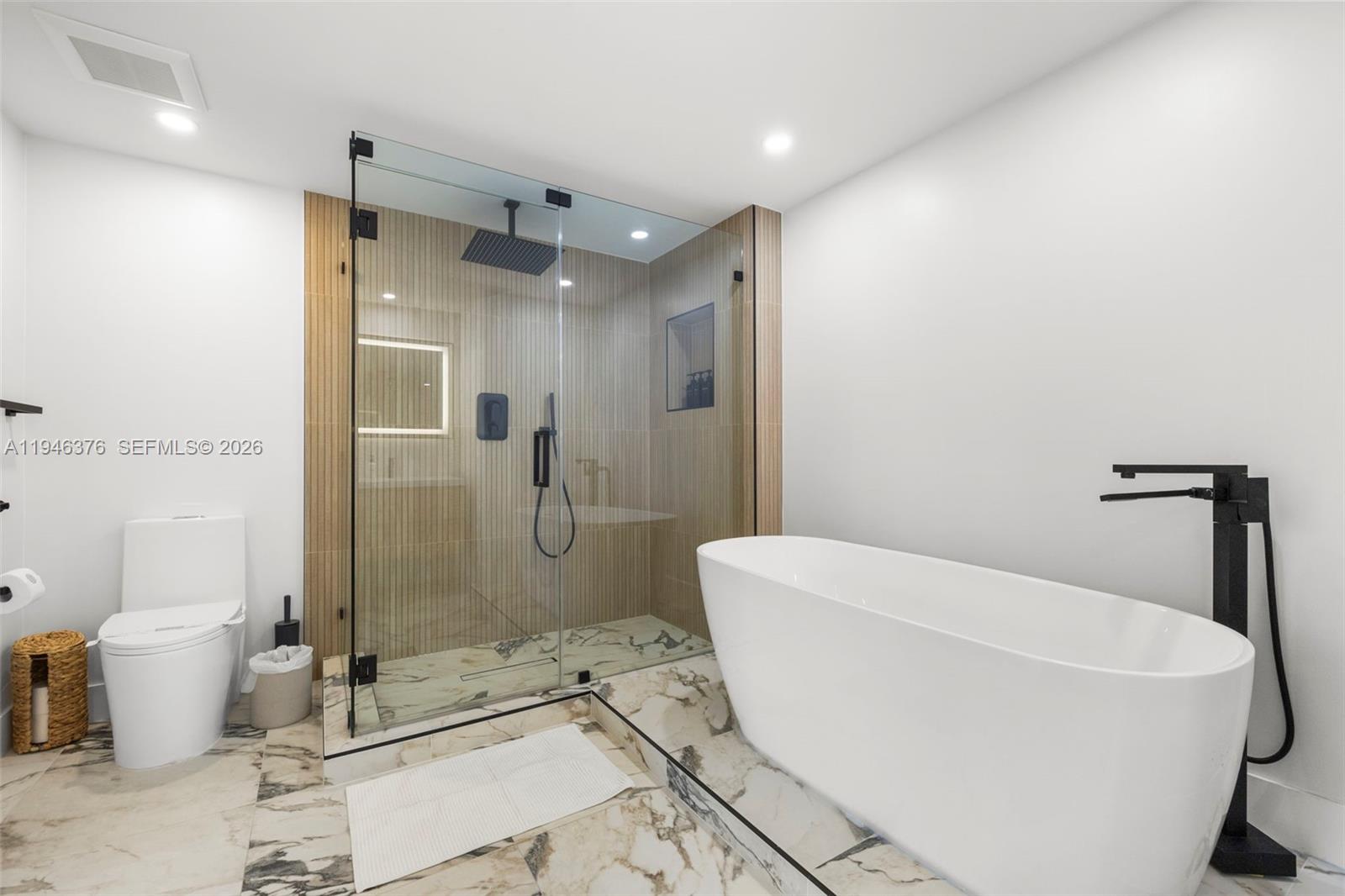 485 Brickell Avenue, Unit 1804 Miami, FL 33131 - Photo 20 of 60 a bathroom with a sink a toilet and shower