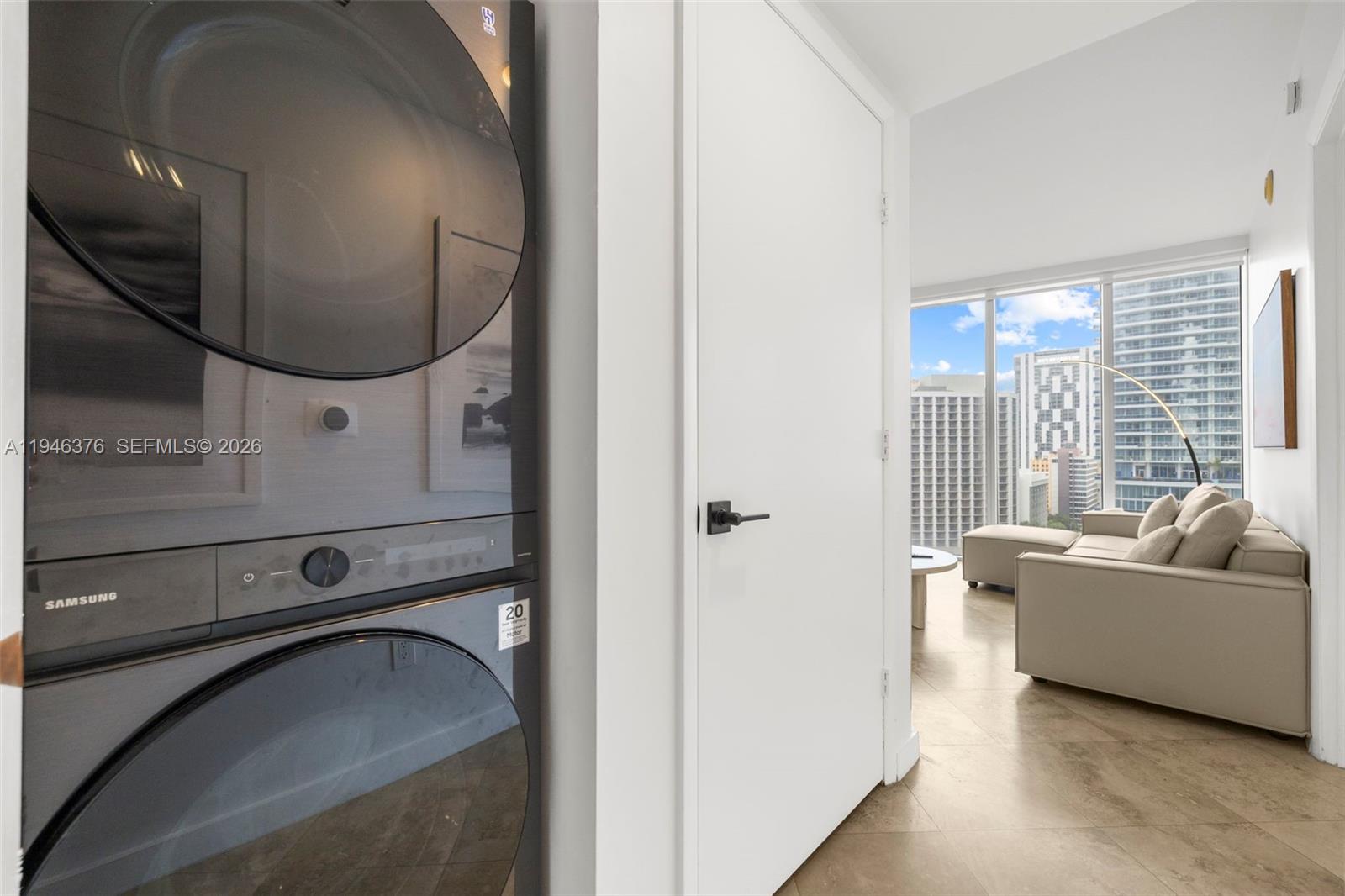 485 Brickell Avenue, Unit 1804 Miami, FL 33131 - Photo 26 of 60 a living room with a couch and a large window