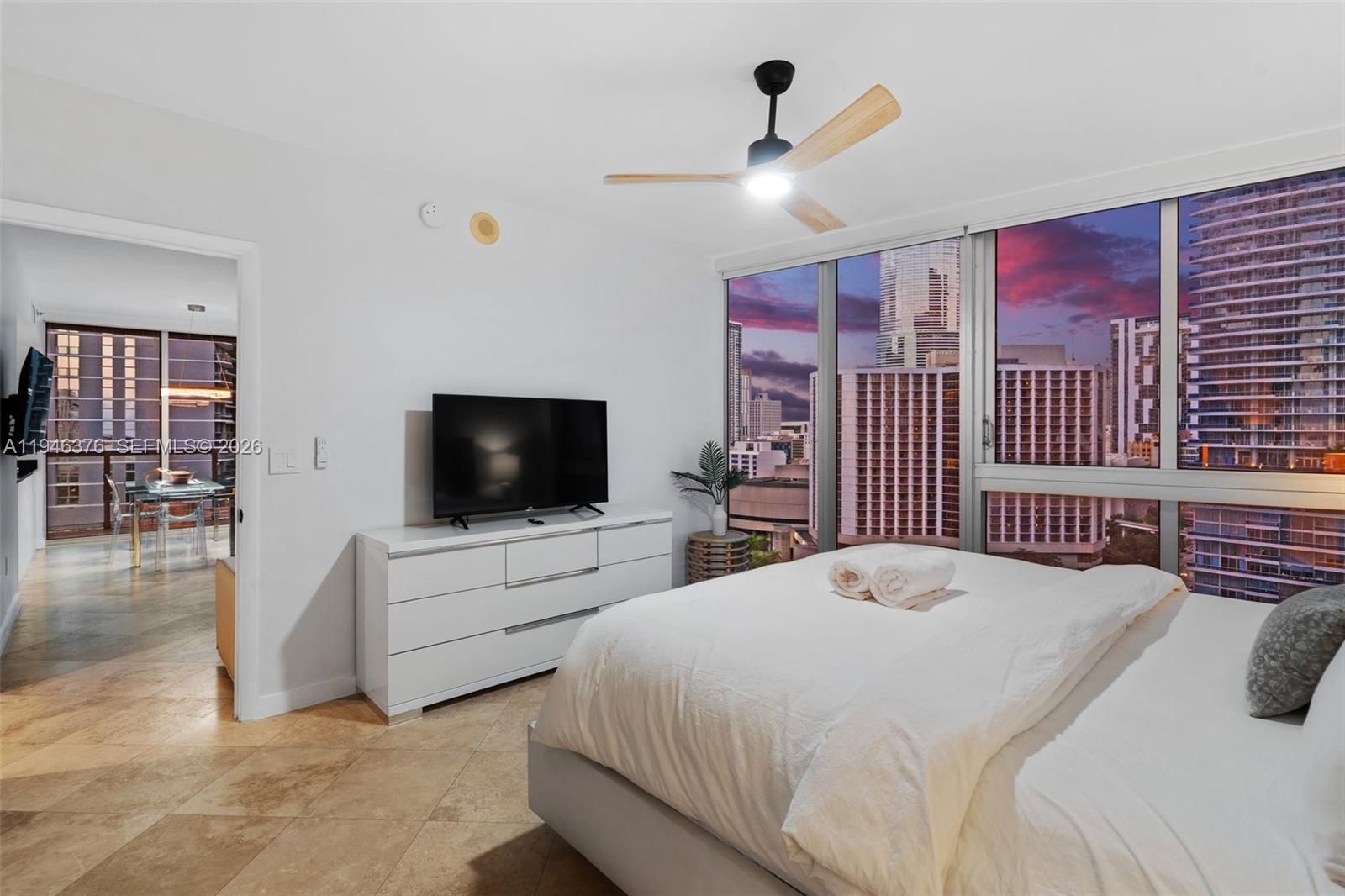 485 Brickell Avenue, Unit 1804 Miami, FL 33131 - Photo 40 of 60 a bedroom with a bed and a flat screen tv