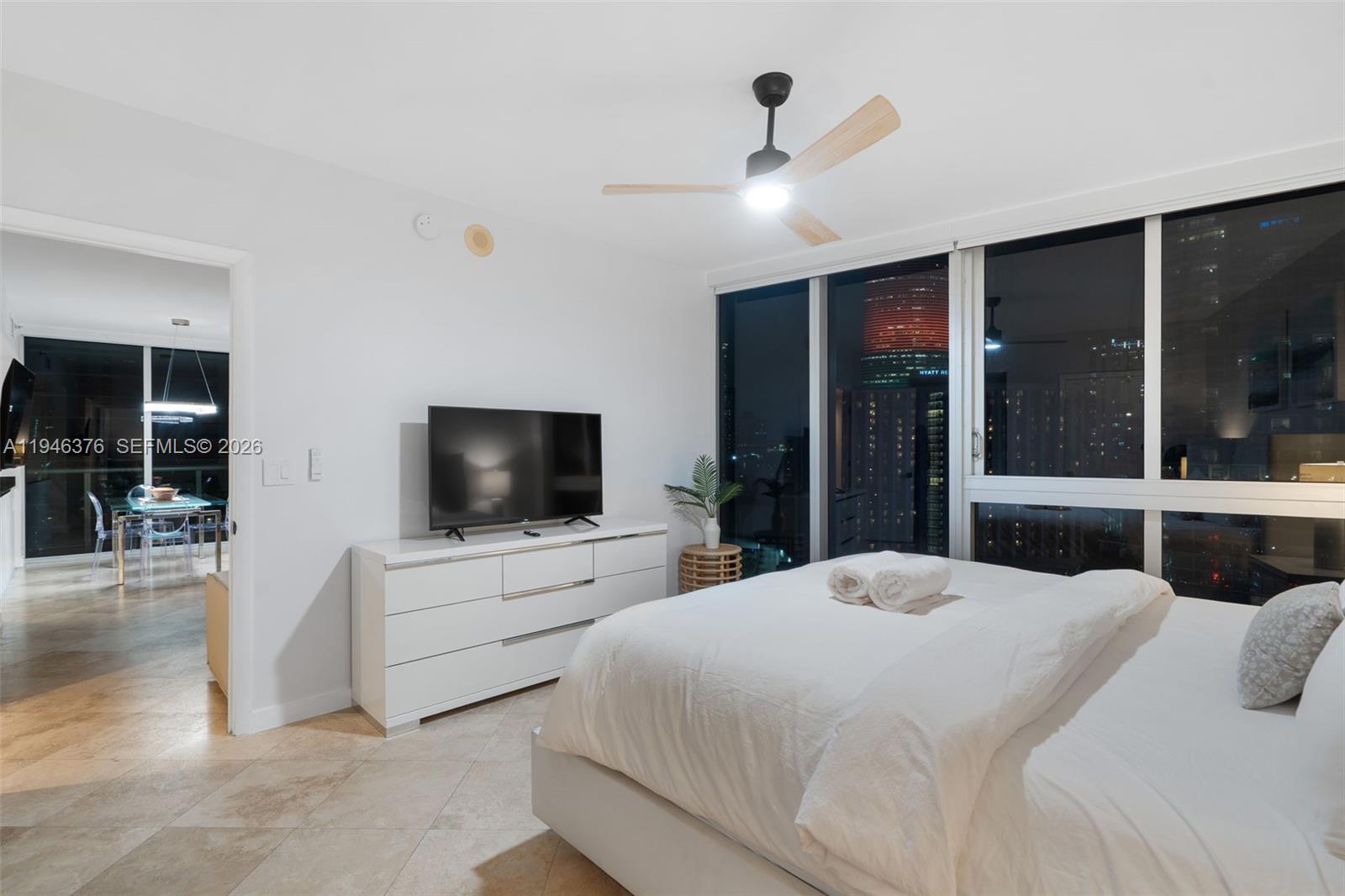 485 Brickell Avenue, Unit 1804 Miami, FL 33131 - Photo 44 of 60 a bedroom with a bed and a flat screen tv