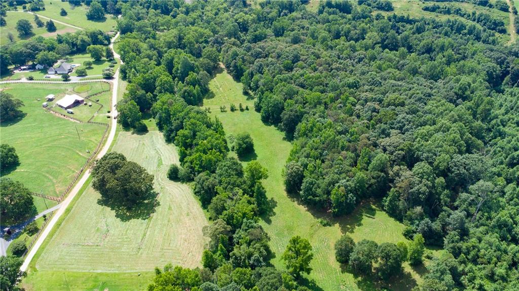 482 Hooper Road Commerce, GA 30530 - Photo 6 of 12 an aerial view of residential houses with outdoor space and trees all around