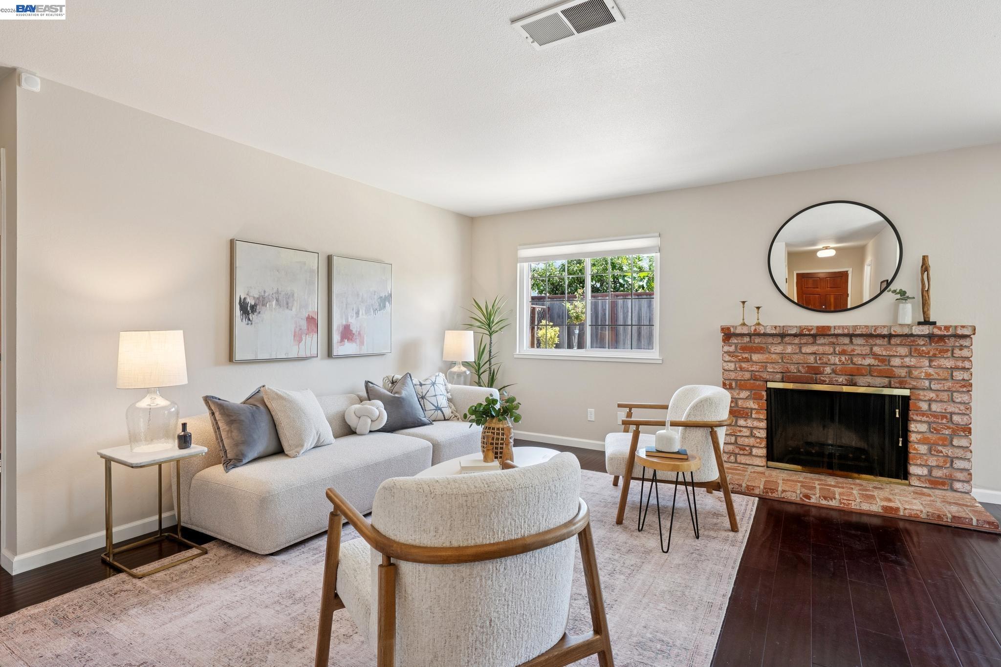 328 Sand Beach Road Alameda, CA 94501 - Photo 9 of 48 a living room with furniture and a fireplace