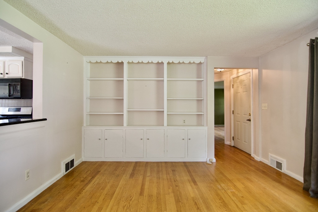 138 West Allen Ridge Road Springfield, MA 01118 - Photo 23 of 42 a view of an empty room with wooden floor and a window