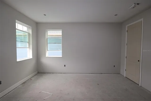 an empty room with windows