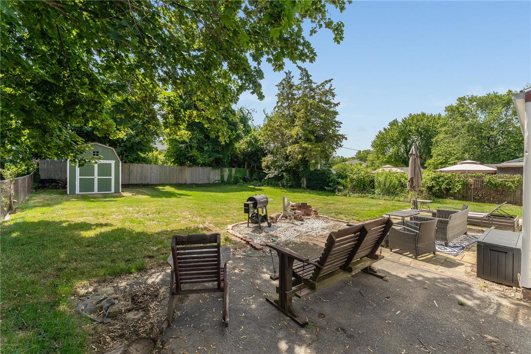 1331 Ridge Trail Easton, PA 18040 - Photo 19 of 22 Nice backyard with a shed, fire pit, and ample space for relaxation or entertainment.