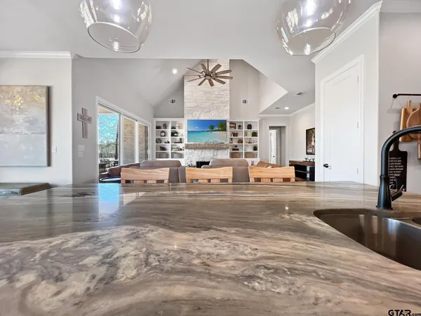 a view of a living room and kitchen