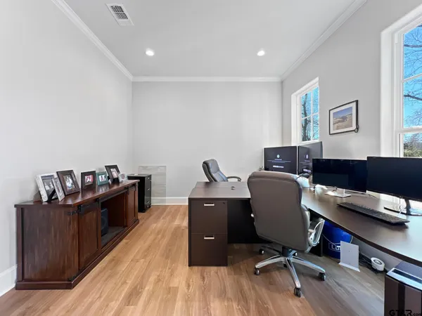 a view of workspace with wooden floor shelves