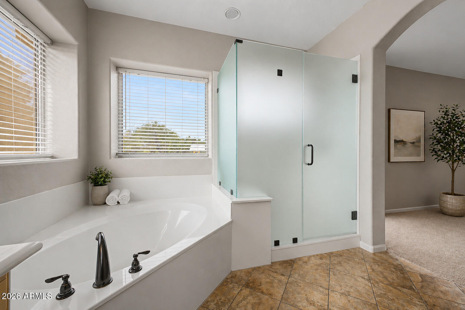1306 East Erie Street Gilbert, AZ 85295 - Photo 27 of 62 a bathroom with a tub a sink and a window