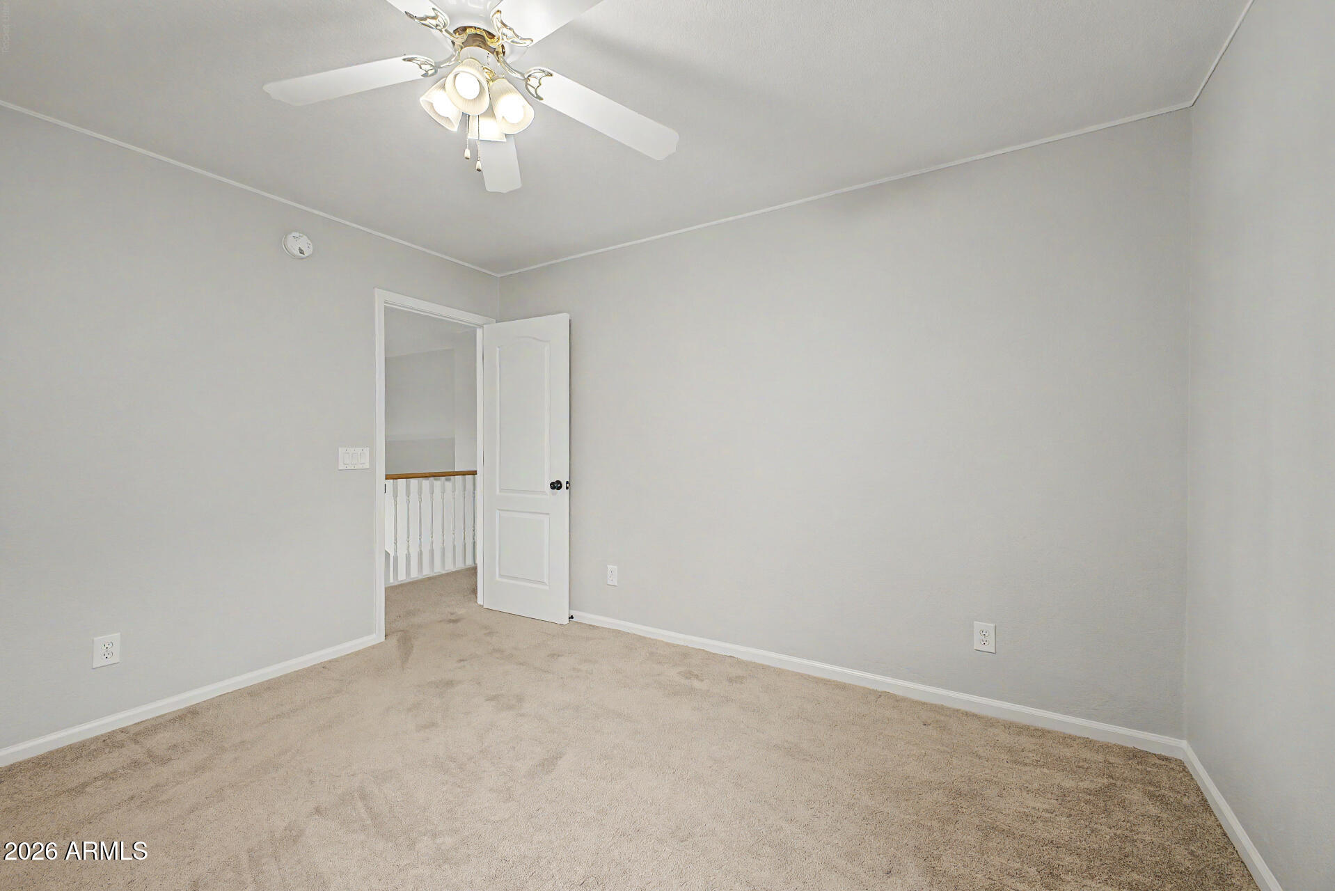 1306 East Erie Street Gilbert, AZ 85295 - Photo 30 of 62 an empty room with a chandelier fan and closet area
