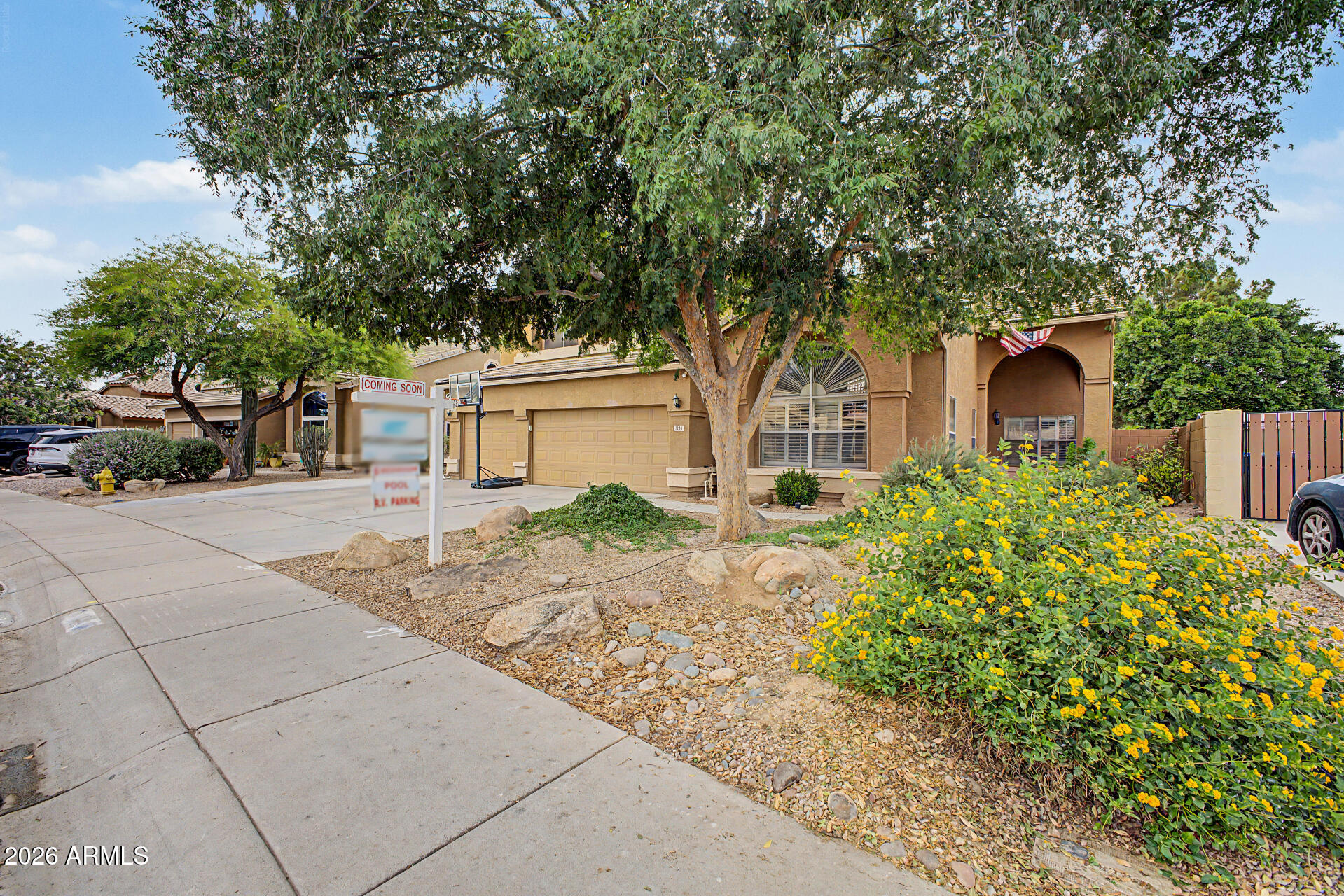 1306 East Erie Street Gilbert, AZ 85295 - Photo 3 of 62 a front view of a house with garden