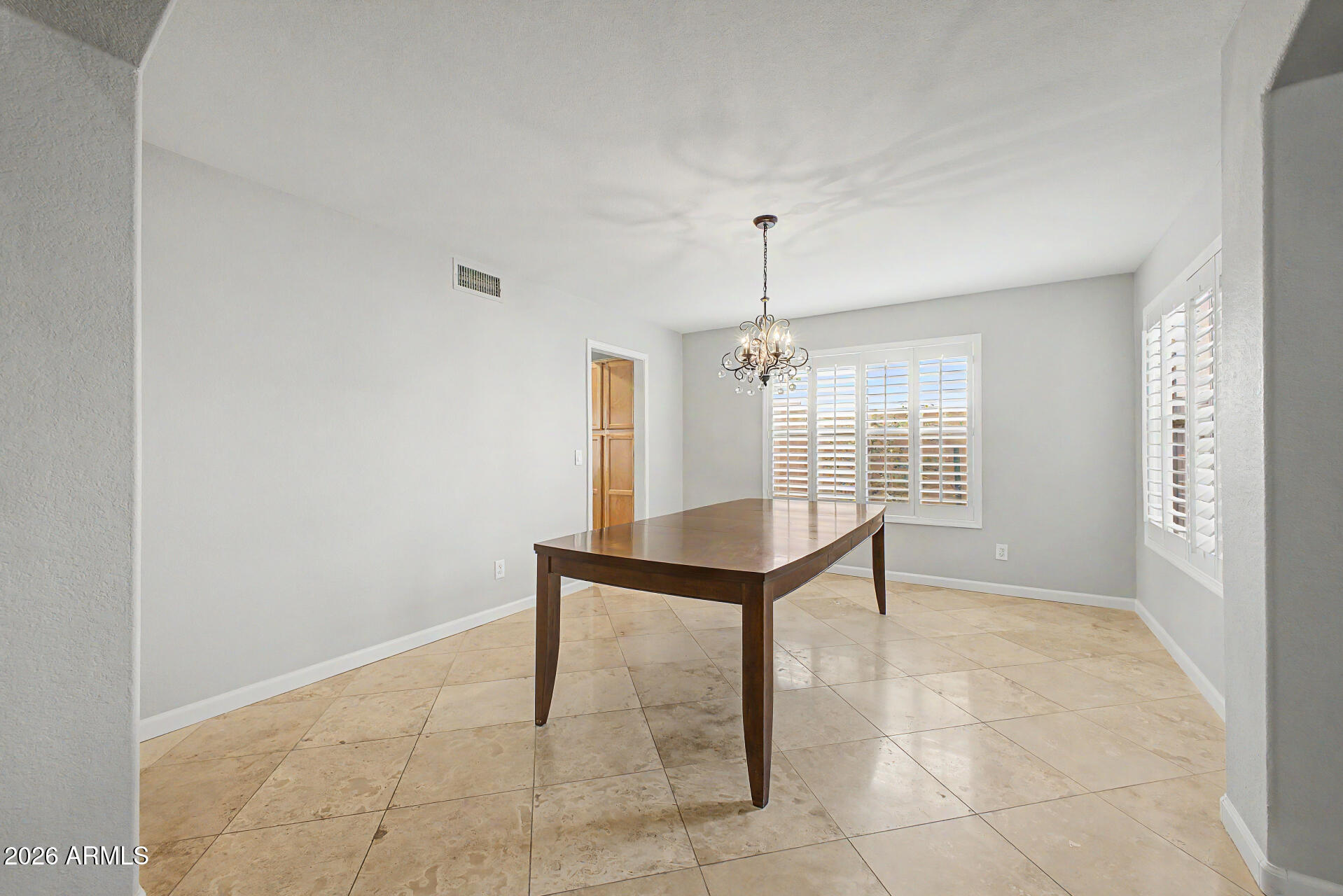1306 East Erie Street Gilbert, AZ 85295 - Photo 8 of 62 a view of an empty room with a window