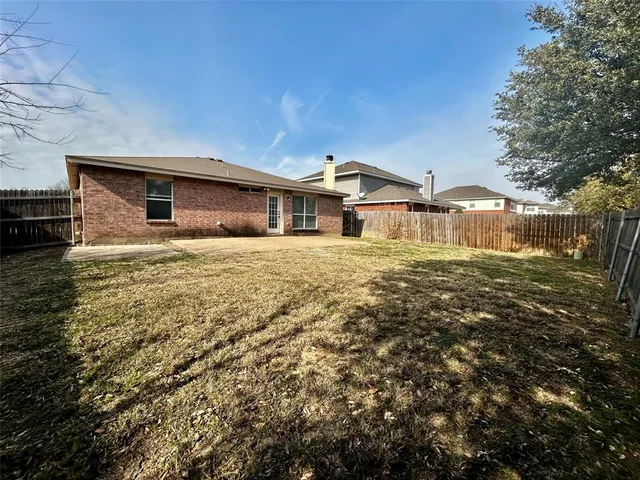 a front view of a house with yard