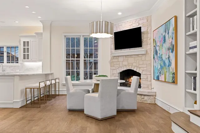 a kitchen with cabinets and wooden floor