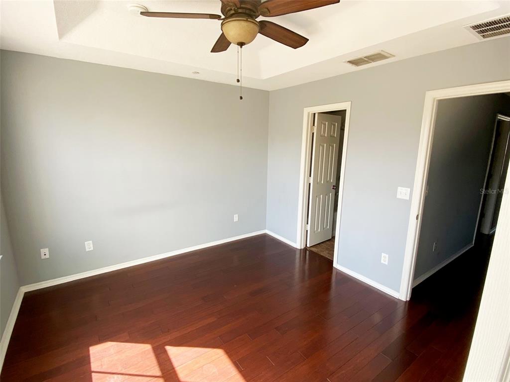 8946 White Sage Loop Lakewood Ranch, FL 34202 - Photo 18 of 36 wooden floor in an empty room