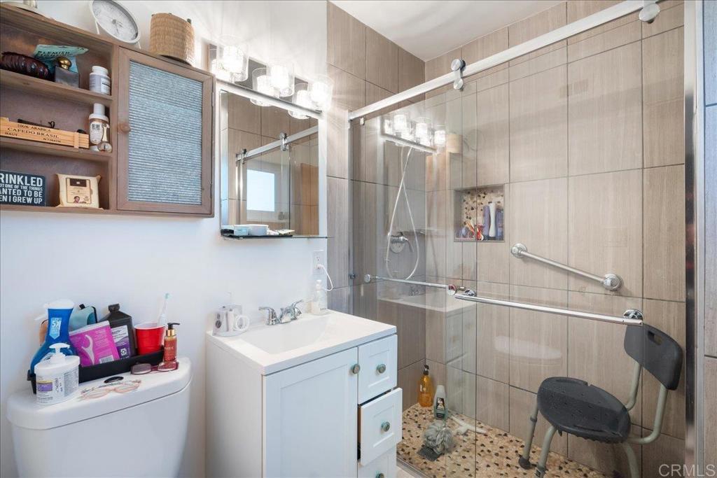 646 Downer Avenue El Cajon, CA 92020 - Photo 14 of 18 a bathroom with a sink and a shower