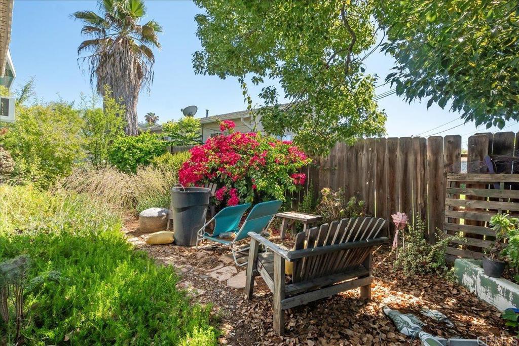 646 Downer Avenue El Cajon, CA 92020 - Photo 16 of 18 a view of a wooden bench and chair in the garden