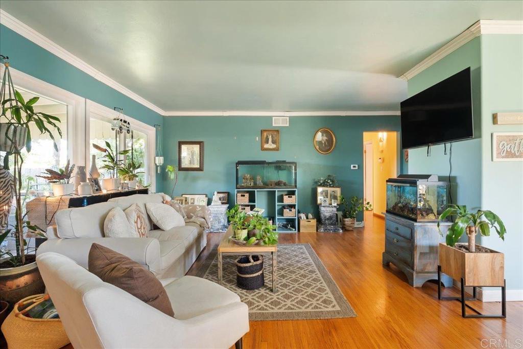 646 Downer Avenue El Cajon, CA 92020 - Photo 6 of 18 a living room with furniture dining table and a fireplace