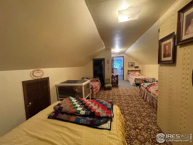 a bedroom with a bed and a table