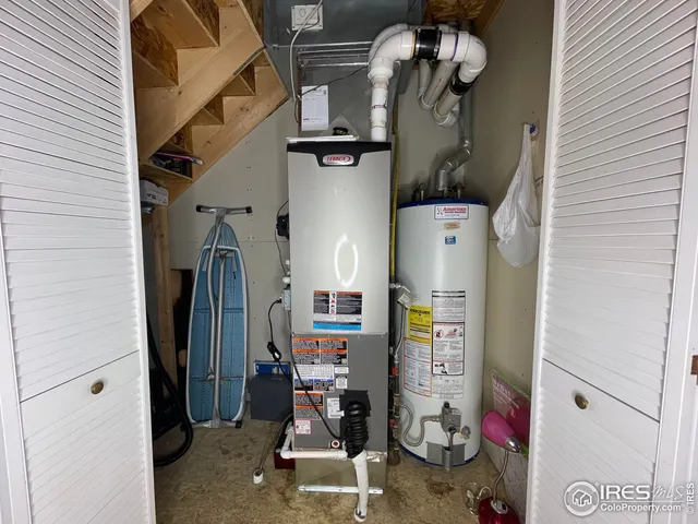 walk in closet with white walls