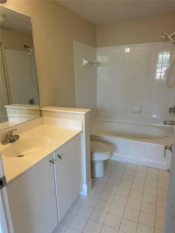 a bathroom with a sink a toilet and a bathtub