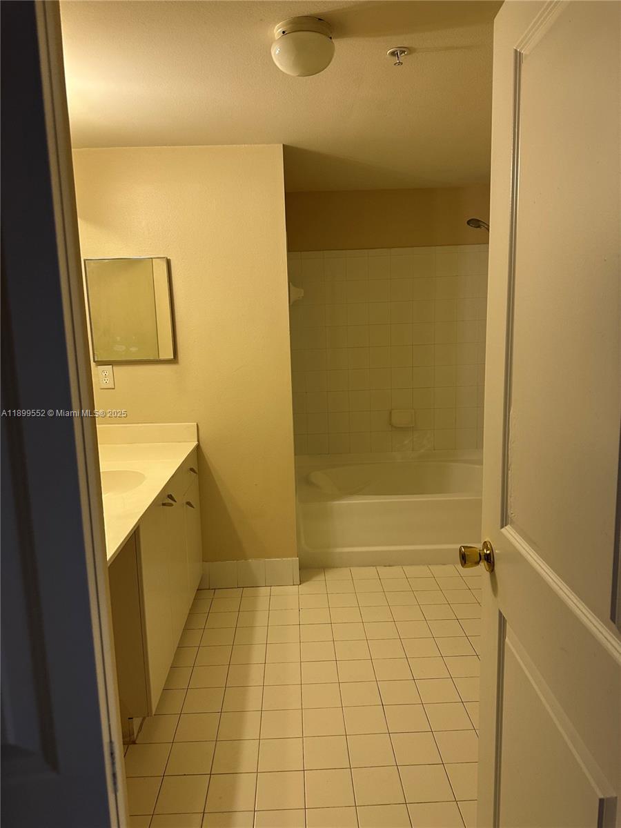 5840 West Sample Road, Unit 306 Coral Springs, FL 33067 - Photo 15 of 22 a bathroom with a shower