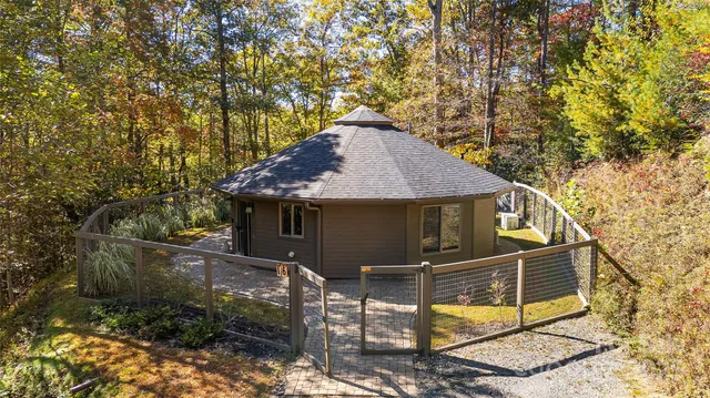 a view of house with yard