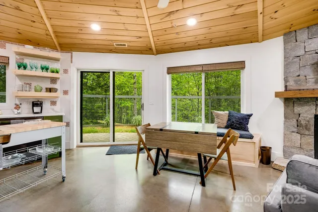 a view of a livingroom with furniture window and outside view