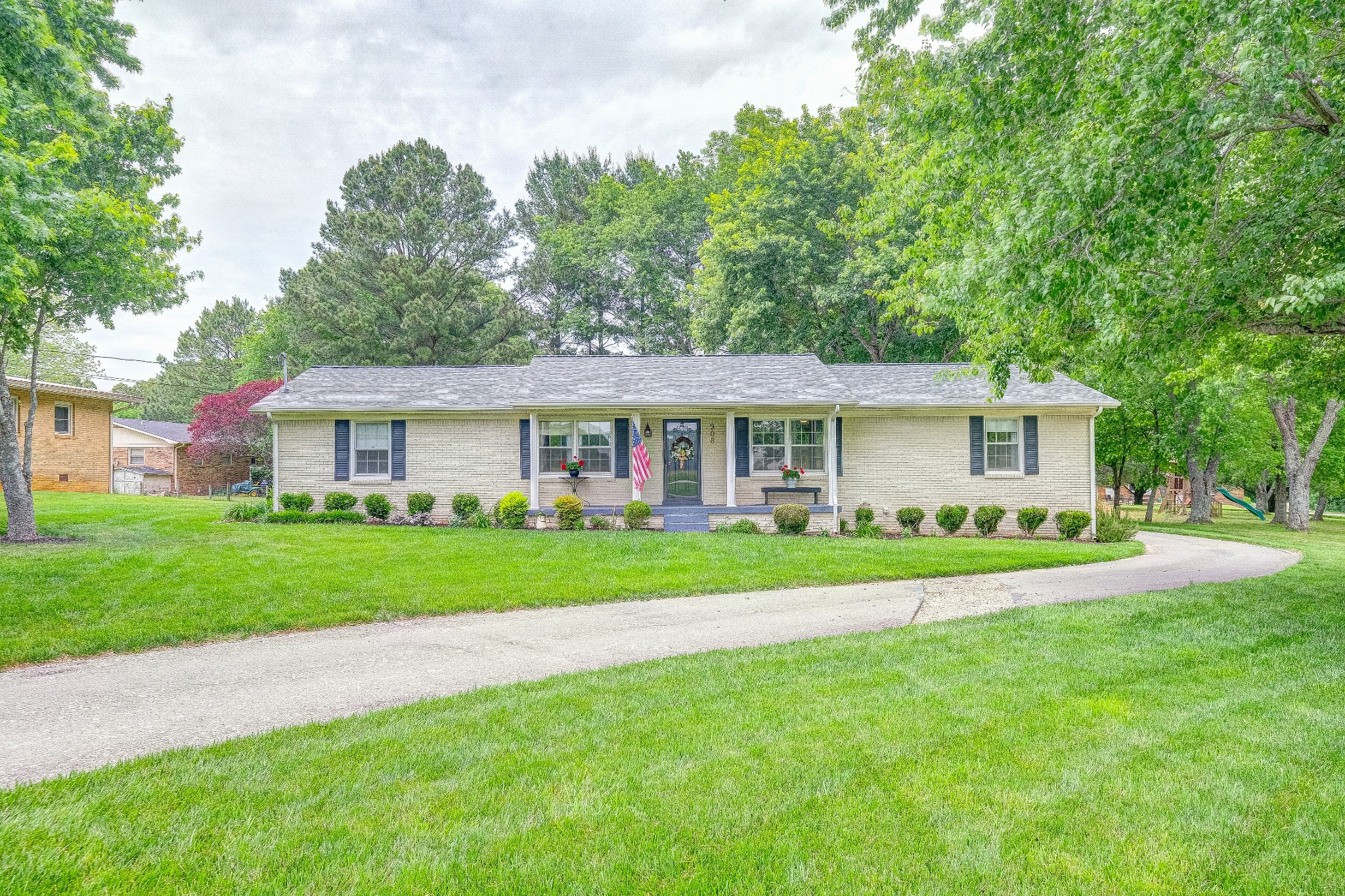 908 Fall River Road Lawrenceburg, TN 38464 - Photo 1 of 22 a front view of a house with a yard and porch