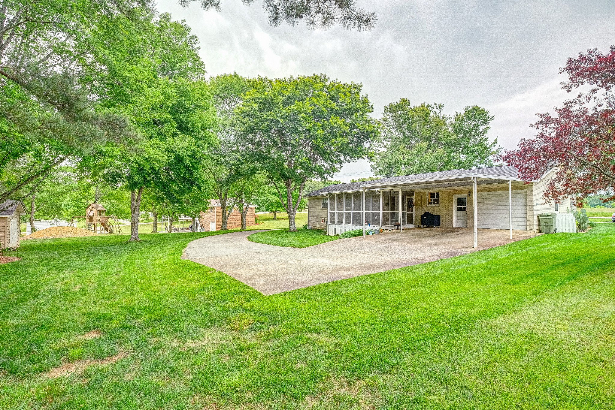 908 Fall River Road Lawrenceburg, TN 38464 - Photo 22 of 22 a front view of a house with garden