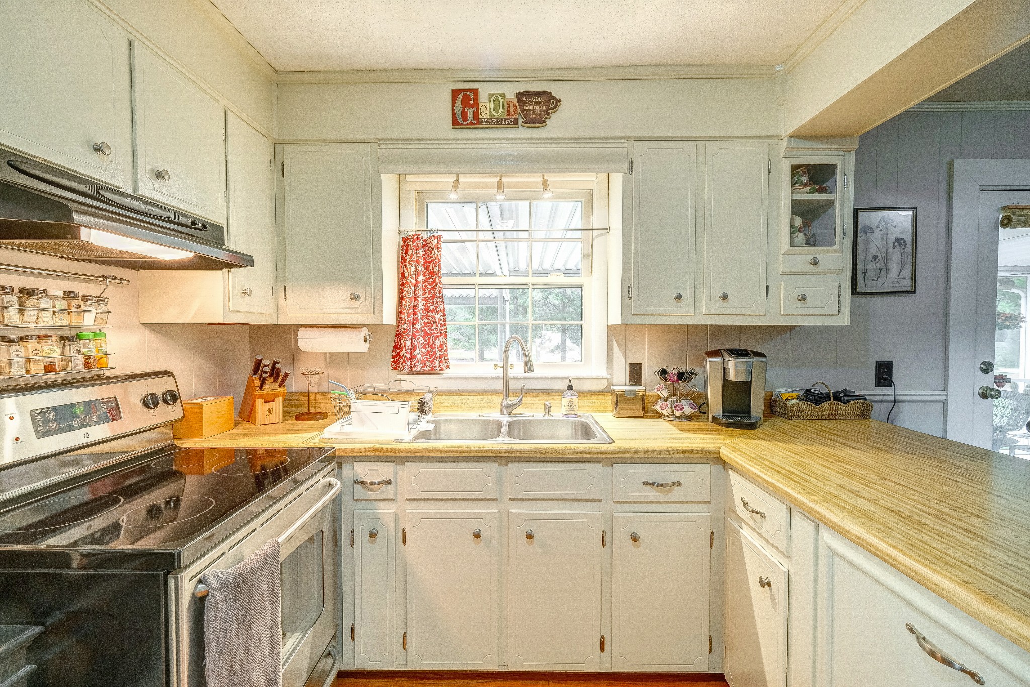 908 Fall River Road Lawrenceburg, TN 38464 - Photo 5 of 22 a kitchen with a sink stove and cabinets