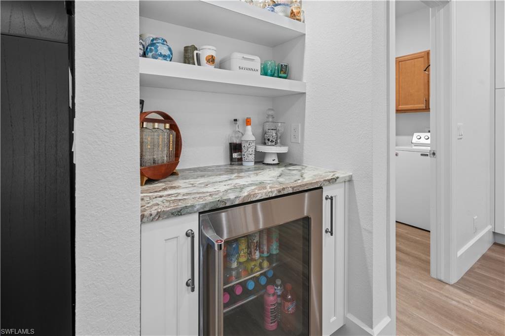 15917 Delasol Lane Naples, FL 34110 - Photo 11 of 32 a utility room with sink dryer and washer
