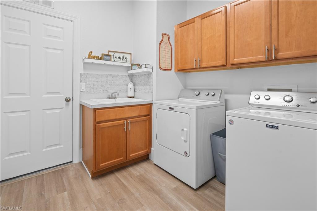 15917 Delasol Lane Naples, FL 34110 - Photo 23 of 32 a utility room with dryer and washer