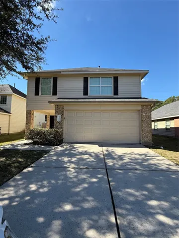 a house view with a backyard space