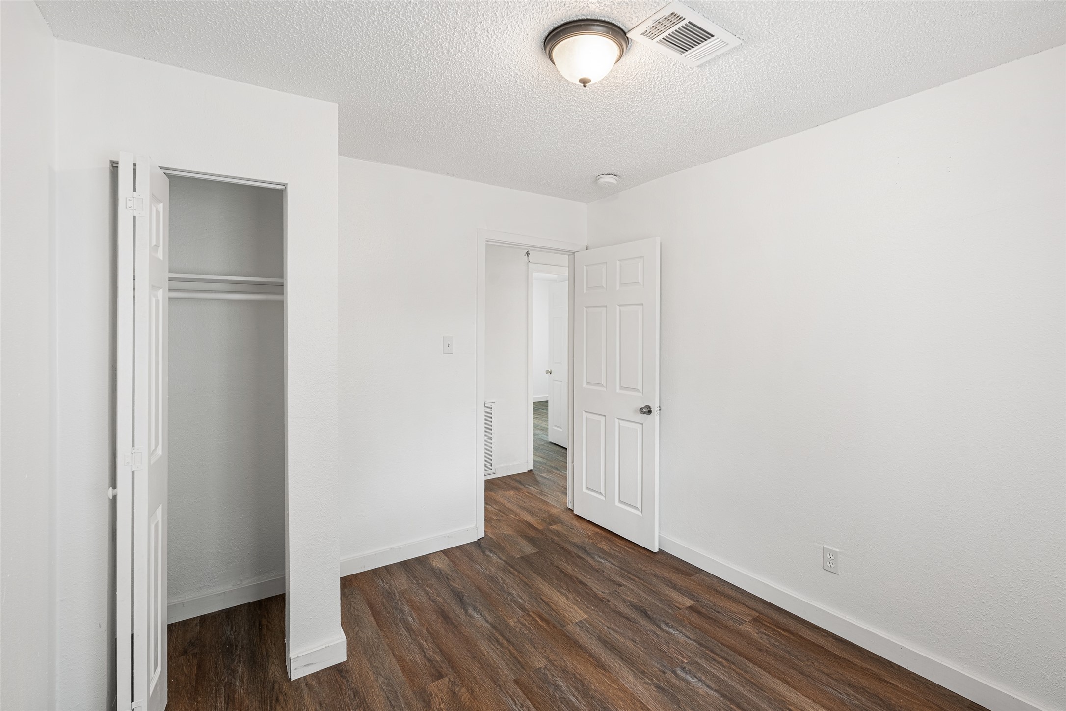 9005 Gabriel Street Houston, TX 77063 - Photo 11 of 21 a view of an empty room with wooden floor