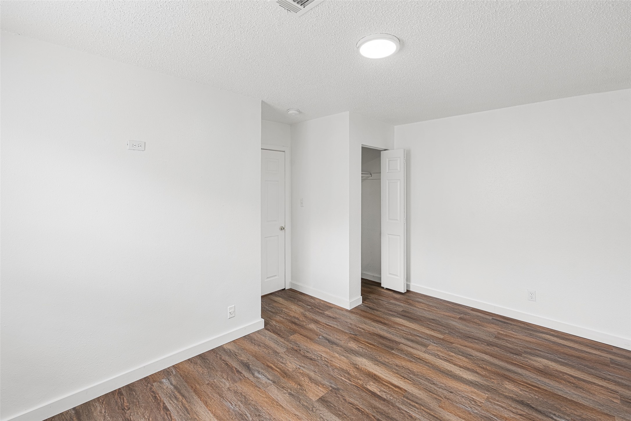 9005 Gabriel Street Houston, TX 77063 - Photo 13 of 21 a view of room with wooden floor