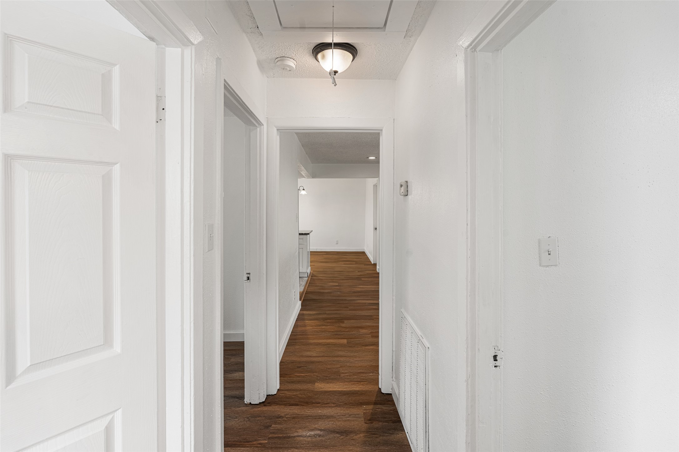 9005 Gabriel Street Houston, TX 77063 - Photo 16 of 21 a view of a hallway with wooden floor and stairs